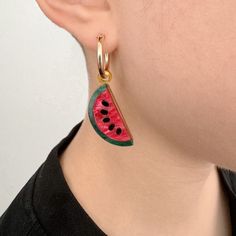 Add a slice of summer to your style with our Watermelon Hoop Earrings, the ultimate playful addition to your summer wardrobe. Laser-cut from marbled fuchsia pink and green acrylic, these lightweight earrings inject a vibrant burst of color into any outfit! Designed for all-day comfort, they're the quintessential summer accessory, perfect for beach days, festivals, or adding a fun touch to your everyday style. The watermelon charms are available to purchase on their own or can be paired with 14k gold-filled or sterling silver hoops. Handcrafted in our London studio, the watermelon earrings will arrive beautifully packaged and will make a delightful gift. Small Hoop Enamel Earrings Gift, Colorful Enamel Hoop Earrings, Summer Novelty Multicolor Earrings, Summer Multicolor Novelty Earrings, Watermelon Earrings, Watermelon Tourmaline Earrings, Luxury Logo, Lightweight Earrings, Fuchsia Pink