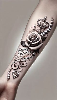 a woman's arm with a rose and pearls on it, in black and white