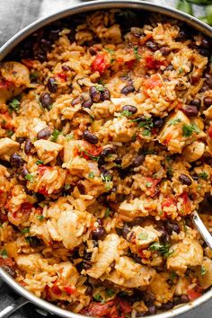 a large pot filled with rice and black beans