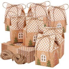 brown paper packages with trees on them and twine wrapped around the top, tied together