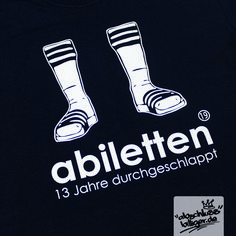 a black shirt with the words abiletten and two feet in white on it