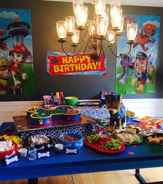 a birthday party with food and decorations on the table