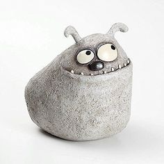 an odd looking rock with eyes and nose