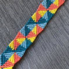 a close up of a tie on a piece of cloth