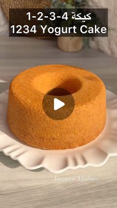 a round cake sitting on top of a white plate