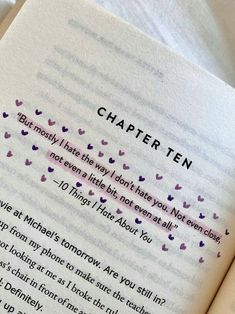 an open book with writing on it and some hearts in the pages that read,'character ten '