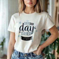 This "Every Day is a Fresh Start" motivational t-shirt is more than just a piece of clothing--it's a reminder that every new day brings fresh opportunities and a chance to grow. Crafted from a luxuriously soft cotton blend, it offers all-day comfort while delivering an empowering message. The design, with a subtle checkered flag graphic, symbolizes new beginnings, motivating you to pursue your goals with optimism and determination.   Features and Benefits: - Soft and comfortable cotton blend fabric - Motivational and inspiring quote design - Stylish checkered flag graphic - Durable, high-quality construction - Perfect for everyday wear    Why Choose This Product? - Unique and inspiring design - High-quality materials and construction - Comfortable, stylish fit - Perfect gift for you or a l Affirmation Clothing, Quote Design, Checkered Flag, Quote Tees, A Fresh Start, Positive Affirmation, Tees For Women, Cotton Blend Fabric, Fresh Start