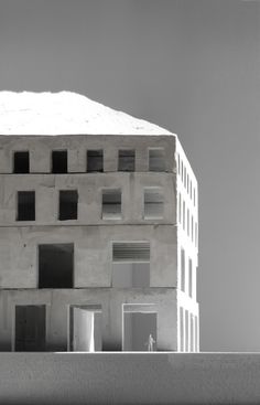 a building made out of concrete with windows