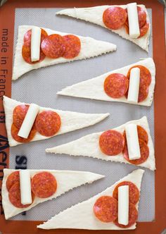 several slices of pizza with cheese and pepperoni on them are arranged in the shape of hearts