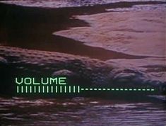 an old television screen with the words volume in green and white on it's side