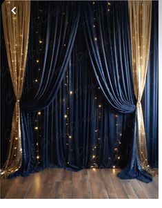 a room with blue curtains and lights on the wall