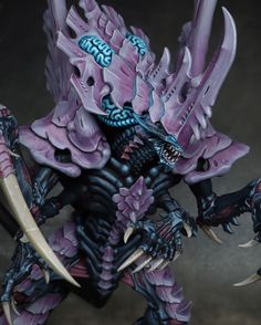 a close up of an action figure on a black background with purple and blue accents