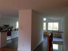 an empty kitchen and dining room in a house