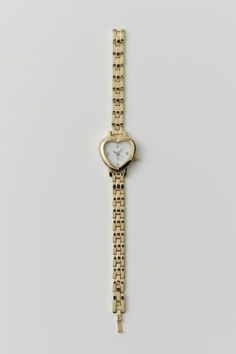 Linked chain watch watch topped with a heart-shaped case we love. Content + Care. Mixed metal, glass Wipe clean Imported Chain Watch, Heart Watch, Watch Jewelry, Jewelry Inspo, Mixed Metals, Cute Jewelry, Cleaning Wipes, Urban Outfitters, Jewelry Accessories