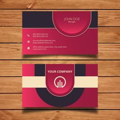 two business cards on wooden background, one is red and the other is black with white stripes