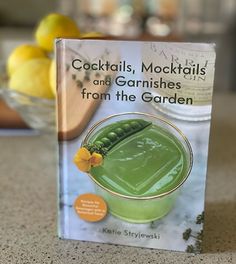 a book on cocktails, mocktails and garnishes from the garden