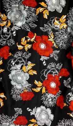 a black and red floral print fabric with white, yellow, and red flowers on it