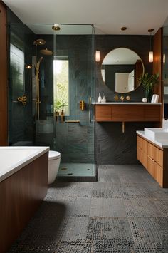 a large bathroom with a walk in shower next to a bathtub and sink under a round mirror