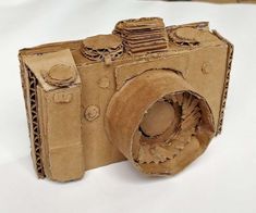 an old camera made out of brown paper