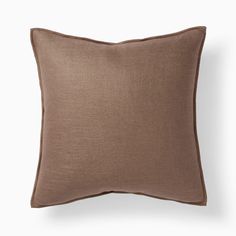 a brown pillow on a white background