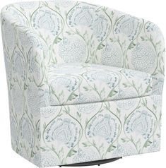 an upholstered chair with blue and green flowers on the back, in front of a white background