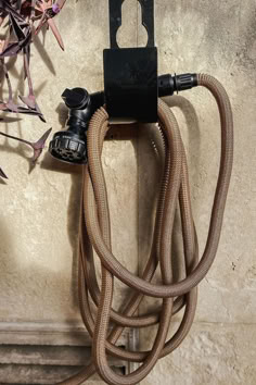 the hose is attached to the wall with an outlet