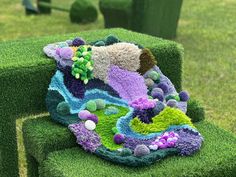 a crocheted purse sitting on top of a green chair