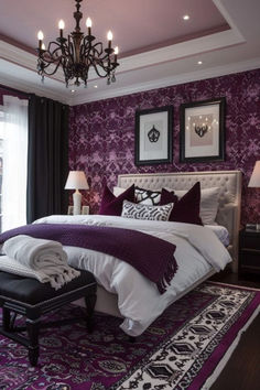 a bedroom decorated in purple and white with a chandelier