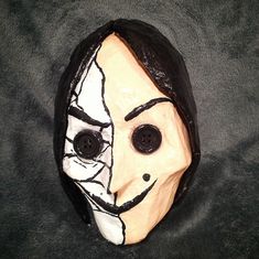 a mask with black and white paint on it