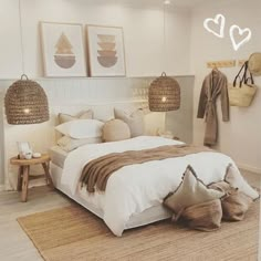 a bedroom with white walls and neutral decor