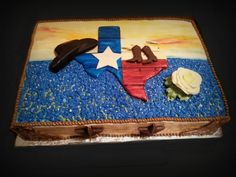 a cake decorated to look like the texas state flag and two birds on top of it