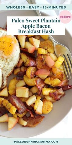 a white plate topped with potatoes and bacon next to an egg on top of it