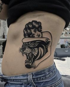 a woman with a tiger tattoo on her stomach