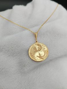 Discover the essence of balance and mythology with our Minimalist Yin Yang Necklace, intricately designed with a Yin Yang Dragon motif in 14K Solid Gold. This exquisite piece blends Chinese mythology and spiritual charm, offering a timeless symbol of harmony and duality. ⚜️ Package included: One Handmade Necklace ⚜️ Pendant Sizes: 14 / 16 / 18 / 20 / 22 / 24 / 26 / 28 / 30 mm ⚜️ Necklace Length: 14 / 16 / 18 / 20 / 22 inches ⚜️ Materials: 925 Sterling Silver / Gold Plated / 14K Solid Gold FAQ: ✈ Yin Yang Dragon, October Jewelry, Yin Yang Necklace, Ganesha Pendant, Dragon Motif, Spiritual Necklace, Preppy Jewelry, Chinese Mythology, Timeless Symbol