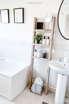 a bathroom with a white bath tub next to a sink and a wooden shelf filled with toiletries