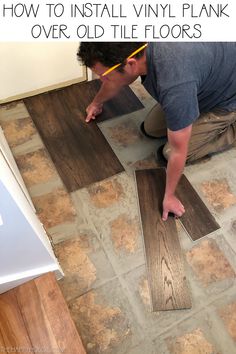 a man installing vinyl planks on the floor