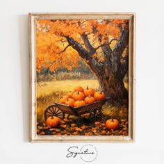 an oil painting of pumpkins in a wheelbarrow by a tree with orange leaves