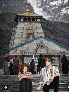 two people sitting on steps in front of a building with snow covered mountains behind them