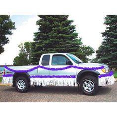 the truck is decorated with purple and white fringes