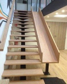 the stairs are made of wood and metal