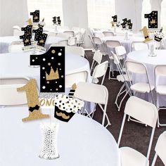 a number one centerpiece is placed on top of a table in a banquet hall