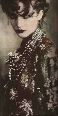 an old photo of a woman with short hair