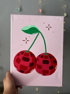 a painting of two cherries on a pink background