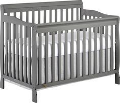 a gray crib with white sheets on the bottom and side rails, in front of a white background