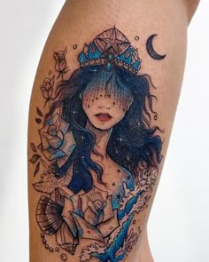 a woman's leg with a tattoo on it and a crown above her head