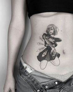 a woman with a tattoo on her stomach