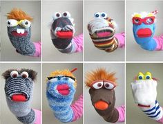 twelve different hand knitted animal mittens with eyes and mouths, all in various styles