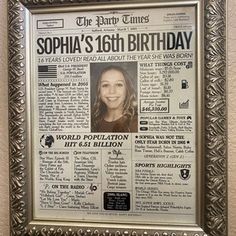 an old newspaper is hanging on the wall in front of a framed poster that reads,'the party times sophia's 16th birthday