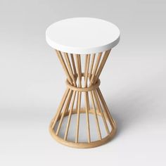 a small white table with wooden legs