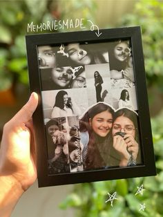 a person holding up a black and white photo in front of green plants with the words memories made written on it